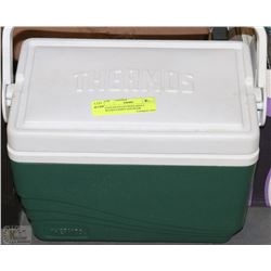 COOLER FILLED WITH ADULT BOARD GAMES AND BOOK