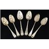 A pair of George III silver gilt berry spoons, embossed bowls chased terminals and vacant cartouc...