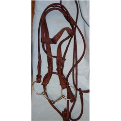 Fancy flat braided headstall with full rd. braided romal, ornate knots