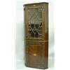 Image 1 : A 19th Century inlaid mahogany corner cabinet, with astragal glazed door, over a fielded panelled...