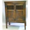 Image 1 : A late 17th Century oak food hutch with planked top and two panelled and barred doors, on stile f...