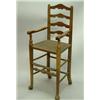 Image 1 : An early 19th Century child's ash high chair, with ladder back and rush seat with foot rest and s...