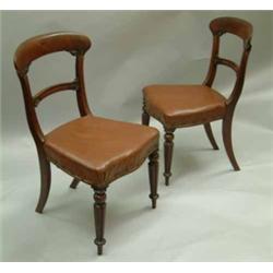 A set of 6 early Victorian mahogany dining chairs, with foliate carved spars and padded seats, on...