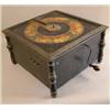 Image 1 : An Ariston table top polyphon, with ebonised case printed with a gilt band of cherubs, 18in. toge...