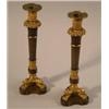 Image 1 : A pair of 19th Century bronze and ormolu candlesticks, with foliate sconces, fluted stems and lio...