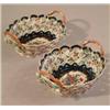 Image 1 : A pair of Samson Worcester style baskets, with painted floral decoration reserved against a scale...