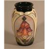Image 1 : A Moorcroft Foxglove pattern baluster vase. 4in....