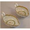 A pair of 18th century Chinese armorial porcelain sauce boats shallow with undulating rims and gi...