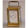 An early 20th Century French gilt brass carriage clock quarter striking with repeat and white ena...