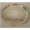 Image 1 : A Victorian silver salver with gadrooned rim and engraved centre of birds and foliage on three pa...
