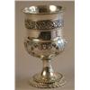 Image 1 : A George III silver goblet shape cup, with fruiting vine band and later repousse oak leaf decorat...