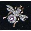 Image 1 : A late Victorian gold 'bug' brooch, set with a ruby and diamonds...