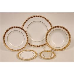 A Wedgwood Part Dinner Service, with grape and vine gilded border, pattern No W4001 (qty)  See il...