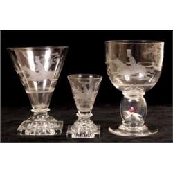 A Table Suite of Late 19th/Early 20th Century Glass, decorated hunting scenes, comprising five ru...