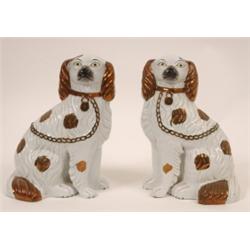 A Pair of Staffordshire Spaniels, with copper lustre decoration, 23 cm  See illustration £30 - 50...