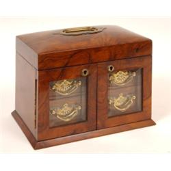A Victorian Walnut Jewellery Box, the lift up lid with a fitted interior above a pair of bevel gl...