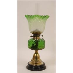 A Victorian Oil Lamp, with an etched glass shade, a green glass reservoir, on a brass column, 57...