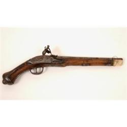 A 19th Century Flintlock Pistol, with carved walnut stock, 42 cm  See illustration £200 - 250...