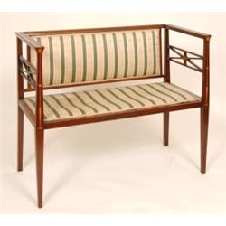 An Art Nouveau Mahogany Two Seat Settee, with tulip inlay, upholstered back and seat, on square t...