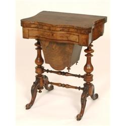 A Victorian Burr Walnut Games Table, the fold over top opening to reveal games boards, with a sin...
