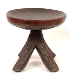 A Tribal Hardwood Stool, the dished circular top on carved quatrefoil base  See illustration £50...