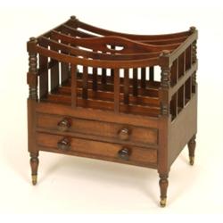 An Early 19th Century Mahogany Canterbury, having four divisions on turned front supports, above...