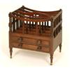 Image 1 : An Early 19th Century Mahogany Canterbury, having four divisions on turned front supports, above...
