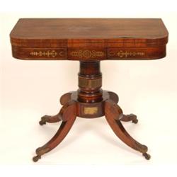 A Regency Rosewood Card Table, the D shape top with cut brass inlay, on a turned barrel support a...