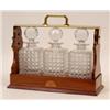 Image 1 : An Edwardian Inlaid Mahogany Tantalus, and cut glass decanters (one a.f.) 41 cm  See illustration...