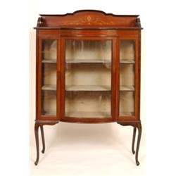 An Edwardian Inlaid Mahogany Display Cabinet, having a gallery above a central glazed door, on ca...