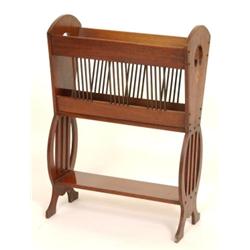 An Edwardian Walnut Magazine Rack, with boxwood inlay, and pierced end supports, 53 cm  See illus...