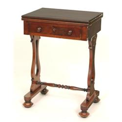 A 19th Century Mahogany Writing Table, the fold over top inset leather above a single frieze draw...