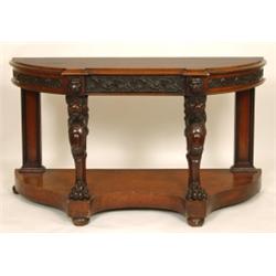 A Victorian Oak Console Table, the carved frieze with a drawer, lion supports on a shaped base wi...