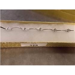 BRACELET - OVAL FACETTED AMETHYST IN STERLING SILVER SCALLOP DESIGNED SETTING - RETAIL ESTIMATE $225