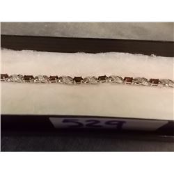 BRACELET - 6.CT (12) OVAL FACETTED GARNET & DIAMONDS IN STERLING SILVER FIGURE 8 DIESIGNED SETTING -