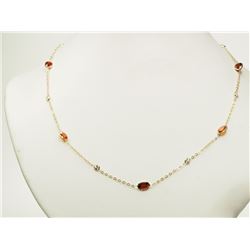 #3-10K YELLOW GOLD GARNET AND WHITE