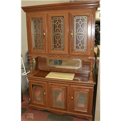 TWO PIECE OAK STYLE HUTCH WITH DECORATIVE GLASS