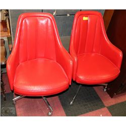 PAIR OF VINTAGE RED SWIVEL CHAIRS ON CASTORS