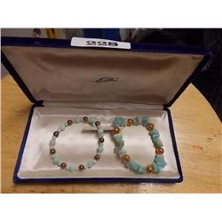 BRACELETS -  AQUAMARINE ROUGH CUT GEMSTONES ON ONE BRACELT & AQUAMARINE POLISHED BEADS ON THE OTHER 