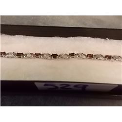 BRACELET - 6.CT (12) OVAL FACETTED GARNET & DIAMONDS IN STERLING SILVER FIGURE 8 DIESIGNED SETTING -