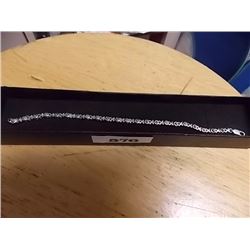 BRACELET - 5 GENUINE DIAMONDS IN STERLING SILVER SETTING - STERLING SILVER FASHIONED IN HUGS AND KIS