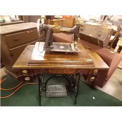 VINTAGE RAYMOND SEWING MACHINE - IN AN OAK CASE TREADLE BASE