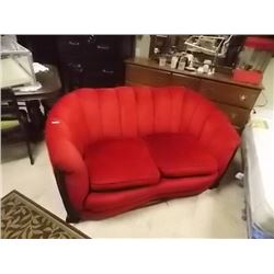VINTAGE RED LOVE SEAT WITH WOOD ACCENT
