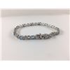 Image 2 : 6CT BLUE TOPAZ AND DIAMOND TENNIS BRACELET, 12 OVAL TOPAZES, INCLUDES $450 CERTIFICATE