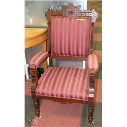 ESTATE WOOD CARVED ARMCHAIR ON WHEELS