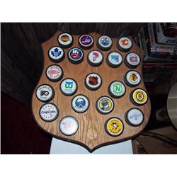 Texaco Shield Covered In NHL Pucks