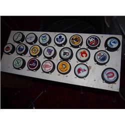 Wall Rack With NHL Pucks
