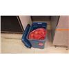 Image 1 : RUBBER MADE TOTE WITH APPROX 50 LB BAG OF ONIONS