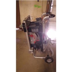 NEWER BOSCH PORTABLE 10" TABLE SAW WITH FOLDING STAND AND WHEELS