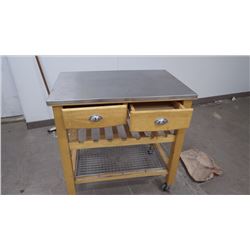 HARDWOOD ISLAND WITH DRAWERS AND SHELF ON WHEELS WITH STAINLESS STEEL TOP AT CAPANNA PIZZA